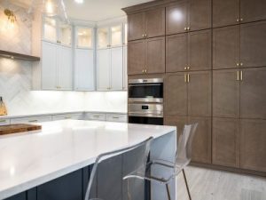 Kitchen with white countertops and brown cabinets