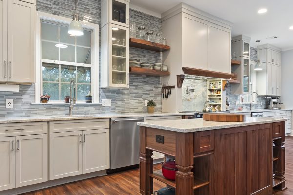 white kitchen remodel with walnut center prep island and custom cabinets