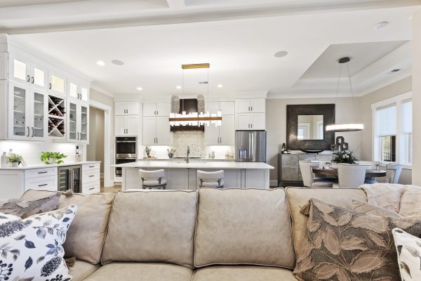 white kitchen with custom cabinets in Margaritaville, SC new construction view from living room