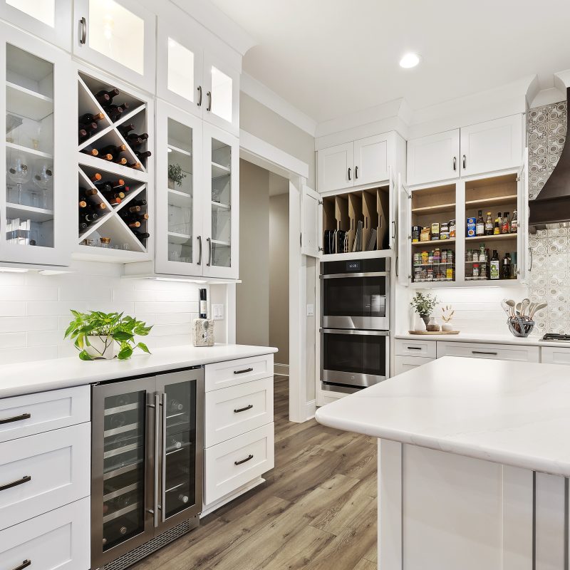 white kitchen with custom glass cabinets in Margaritaville, SC new construction