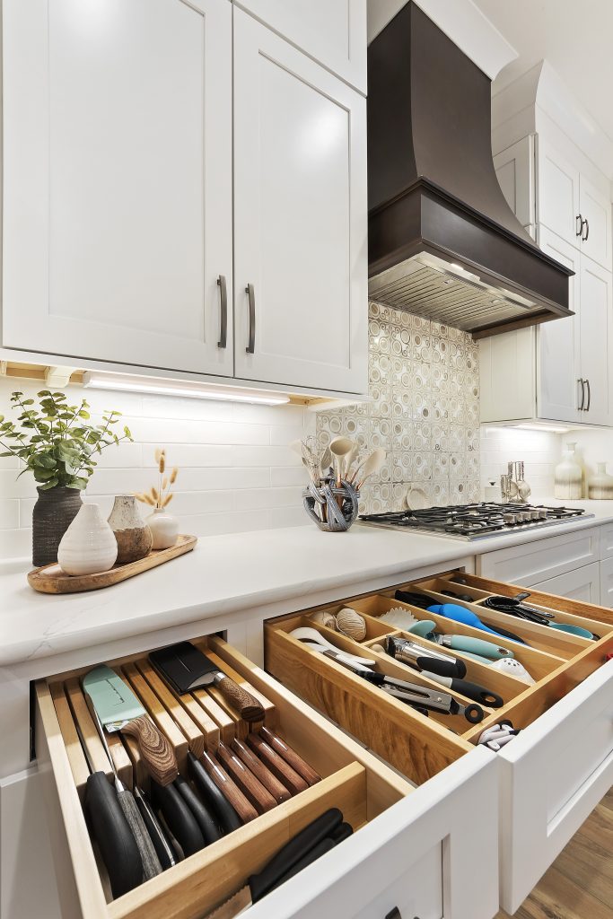 white kitchen with custom utensil cabinets in Margaritaville, SC new construction