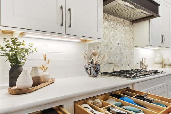 white kitchen with custom utensil cabinets in Margaritaville, SC new construction