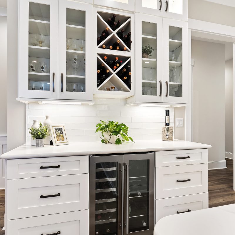 custom white kitchen cabinets and dry bar in Margaritaville, SC new construction