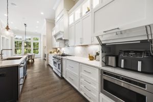 Light and bright kitchen remodel with dark island hilton head